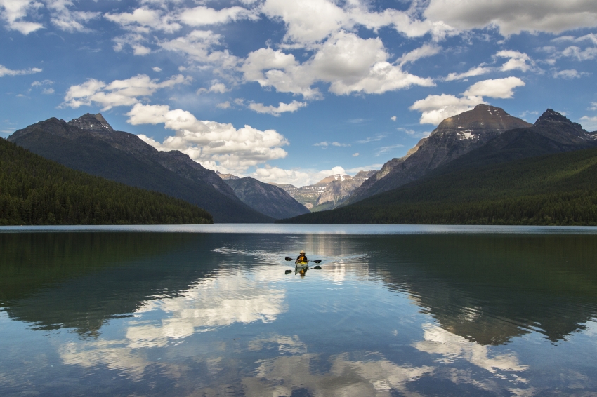 reflection on bowman lake with kayaker
