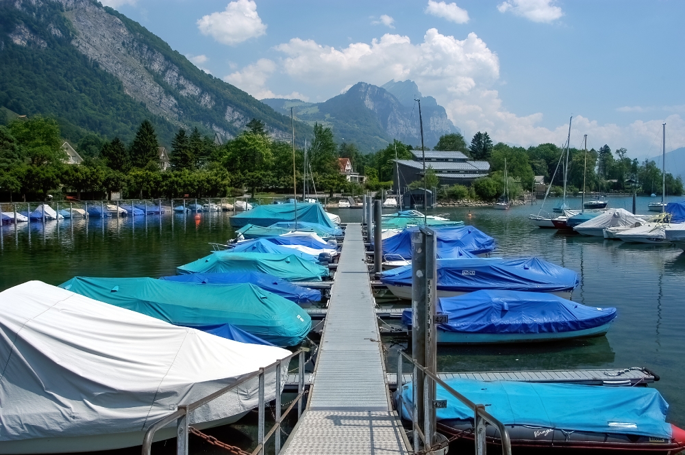 Switzerland lake full of covered boats