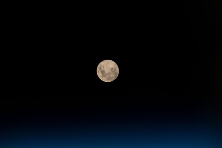 the full moon above the south atlantic ocean