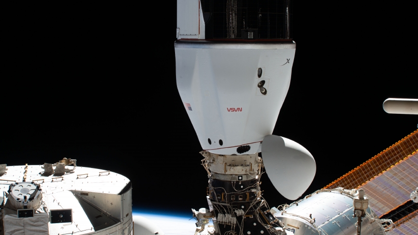 the spacex cargo dragon cargo craft is pictured docked to the sp