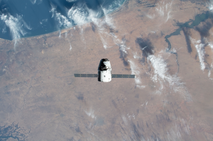 the spacex dragon cargo craft approaches the space station 1