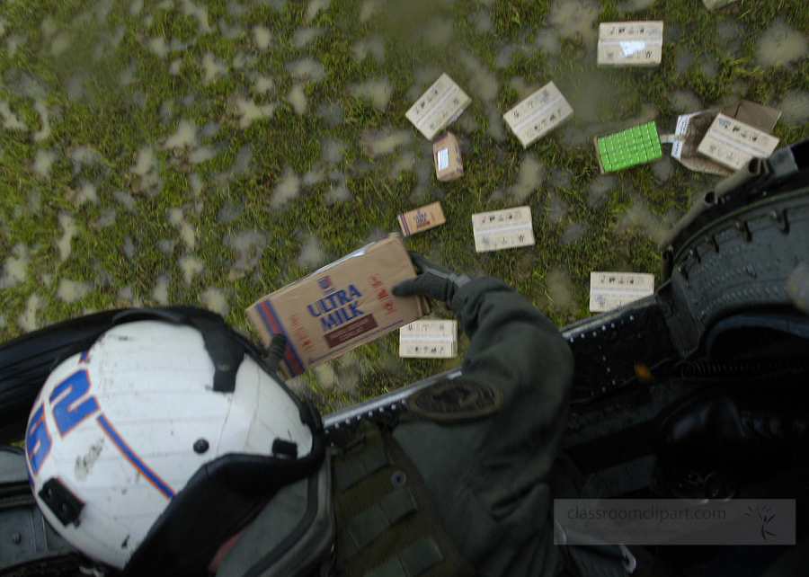 drops food and milk onto a field to help out Indonesians in need