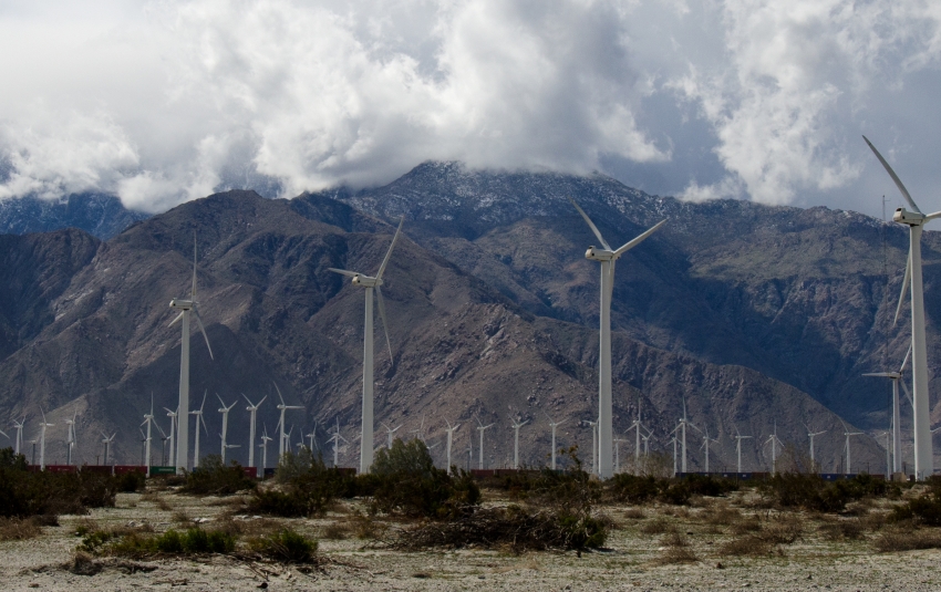 windmills in California Desert with Mountains in background