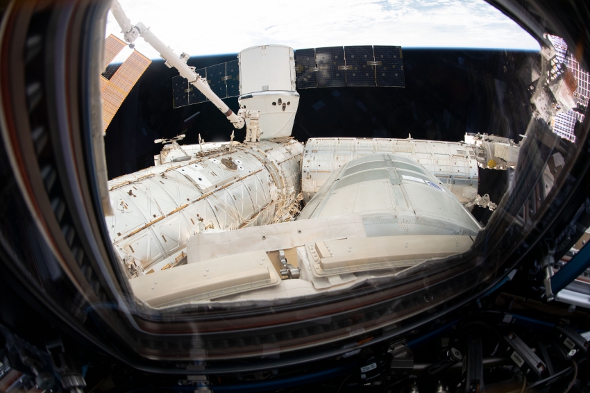 the spacex dragon cargo craft resupply ship is pictured attached ...