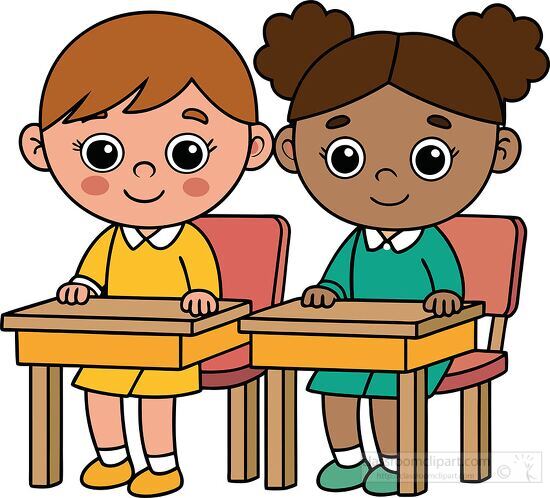 Two children smiling and sitting at their desks