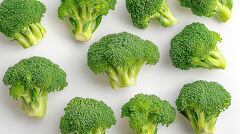 Fresh Broccoli Arranged Artistically on a White Background