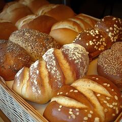 Variety of Freshly Baked Bread Displayed in a Basket