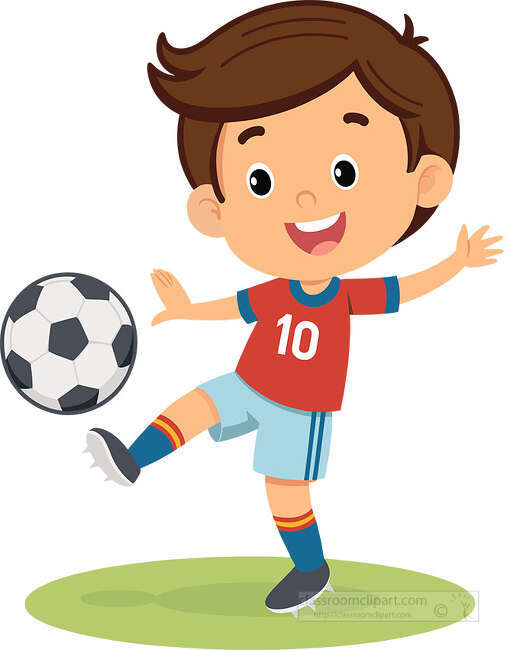 Smiling boy soccer player wearing a red number 10 jersey kicking a soccer ball