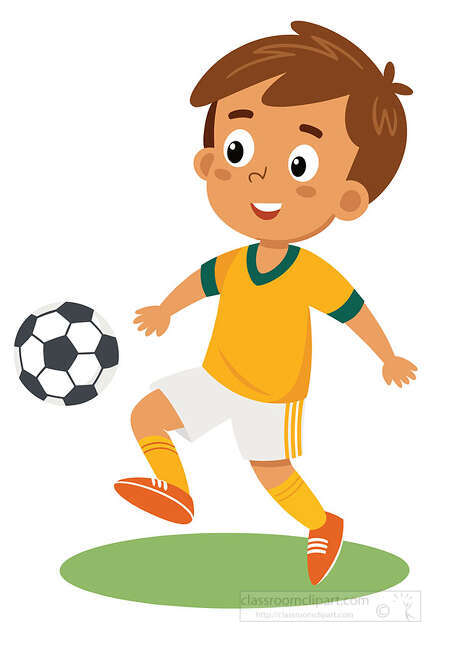 Smiling boy soccer player in a yellow uniform kicking a ball on grass for sports themed use