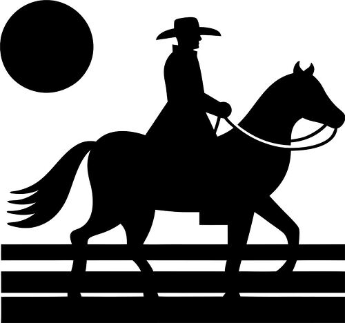 Silhouette of a cowboy riding a horse near a setting sun