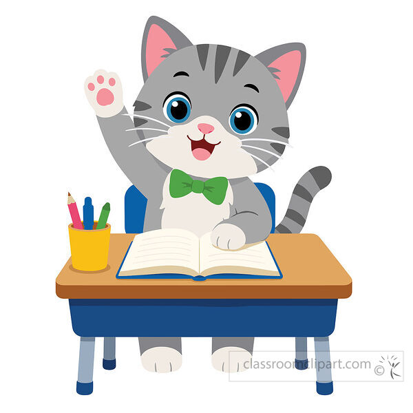 A gray cat with a green bow tie raises one paw while sitting at a desk with an open book and pencils