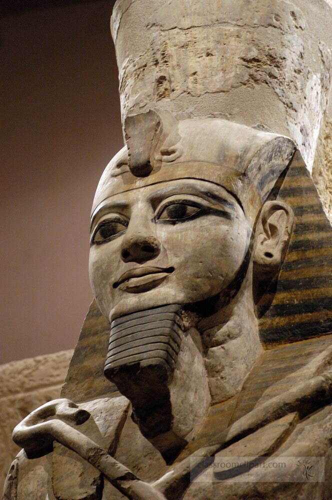 A detailed statue of an ancient Egyptian ruler stands in Aswan showcasing remarkable craftsmanship The sculpture features intricate facial details and distinct headdress elements