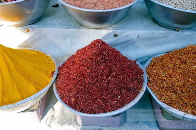 Vibrant piles of spices are organized in bowls at a market in Aswan Egypt The rich colors of turmeric saffron and other spices entice visitors and locals alike