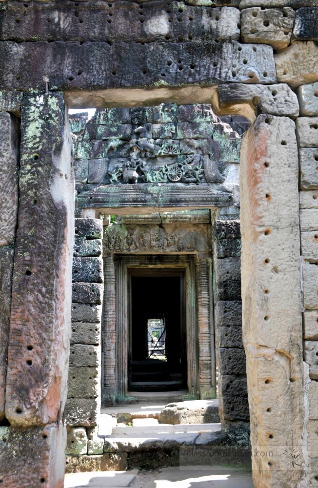 Wandering through the historic passageways of Angkor Wat visitors admire intricate stone carvings and the unique architecture that showcases the grandeur of ancient Khmer civilization.