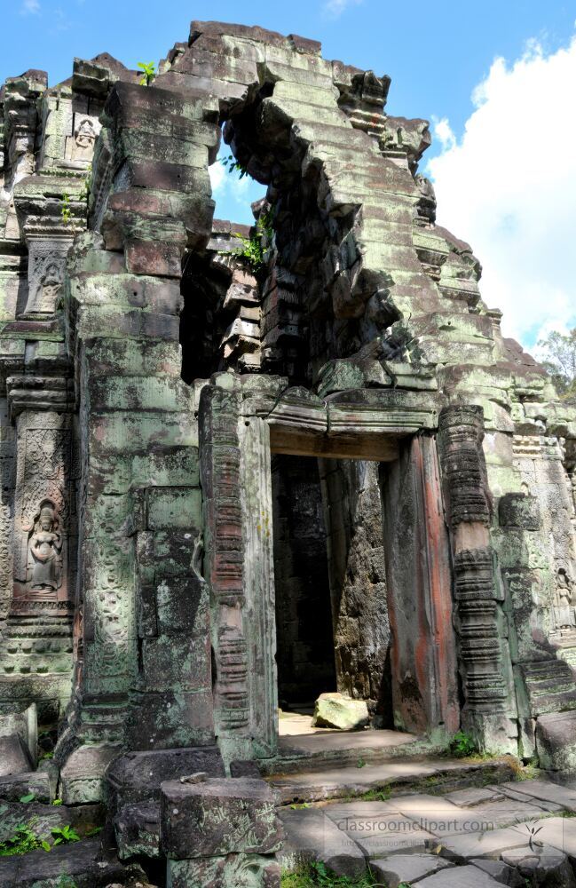 Majestic stone ruins rise from the lush landscape in Siem Reap Cambodia. Sunlight filters through the ancient archways revealing intricate carvings that tell stories of a rich history and culture.