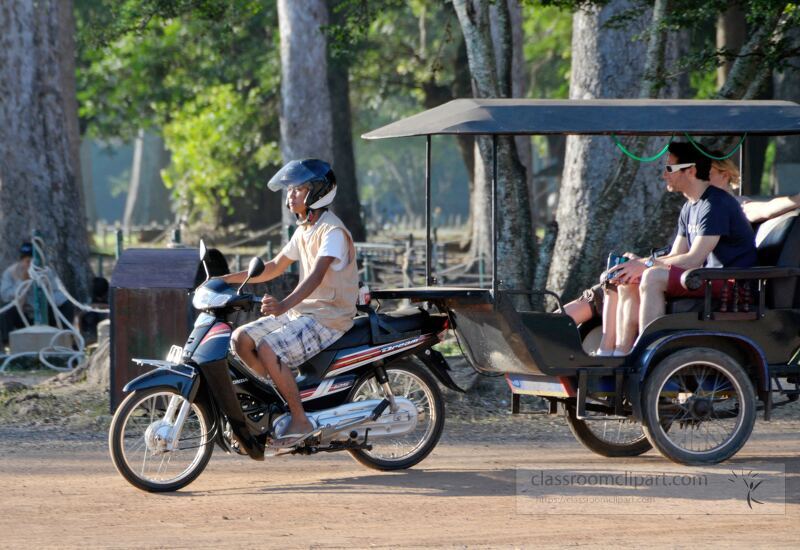 Travelers enjoy a unique journey through the vibrant streets of Siem Reap Cambodia riding in a rickshaw surrounded by lush greenery and the charm of local culture during a sunny day.