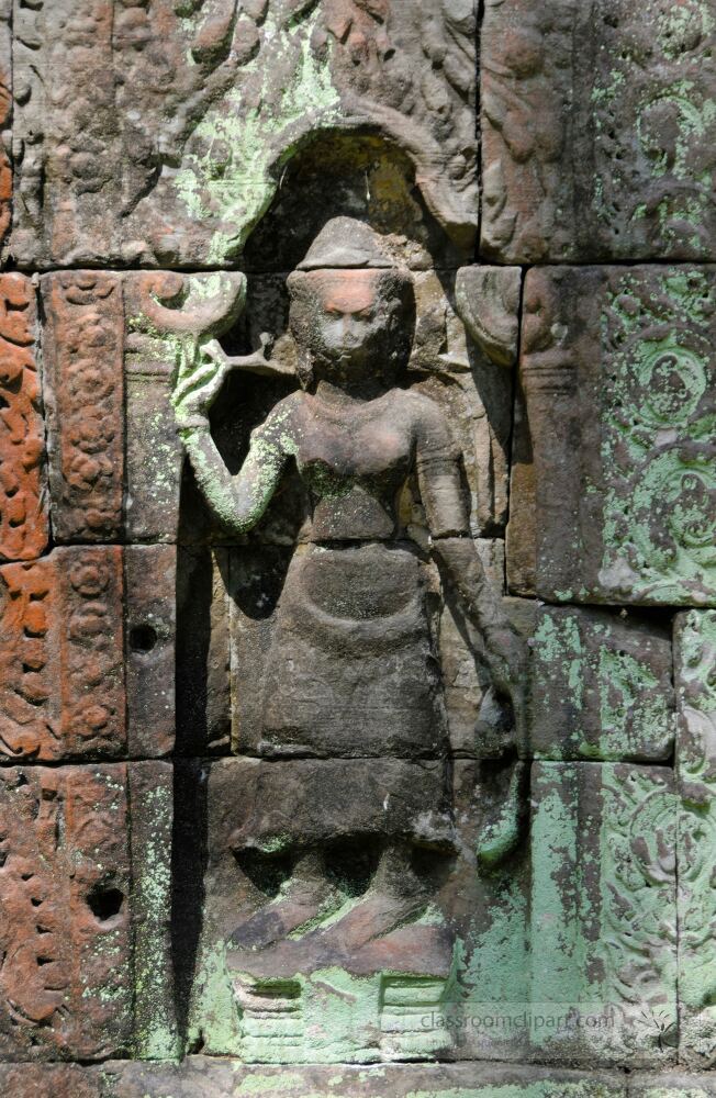 Ancient stone sculpture showcases skilled artistry at Siem Reap Angkor Wat in Cambodia. The detailed figure reflects the rich history and cultural significance of the site during sunrise.