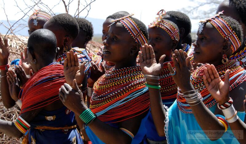 Groups of Samburu women in colorful attire engage in a vibrant dance under the African sun Adorned with intricate beadwork they showcase their cultural heritage through rhythm and movement amid the arid landscape of Samburu Kenya