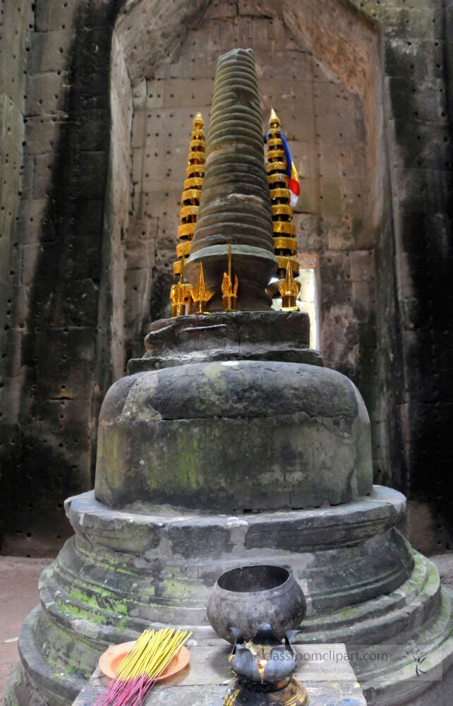 A beautifully crafted stone stupa adorned with golden spires stands majestically within the ancient walls of Angkor Wat in Siem Reap Cambodia symbolizing the rich spiritual heritage of the region.