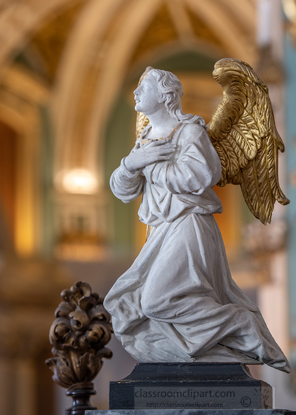 closeup-view-of-an-angel-with-folded-hands-over-heart.jpg
