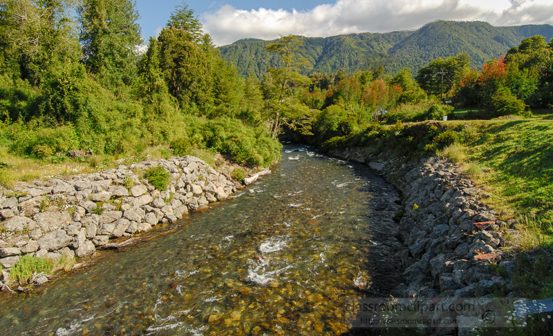flowing-river-surrounded-by-trees-and-mountains.jpg