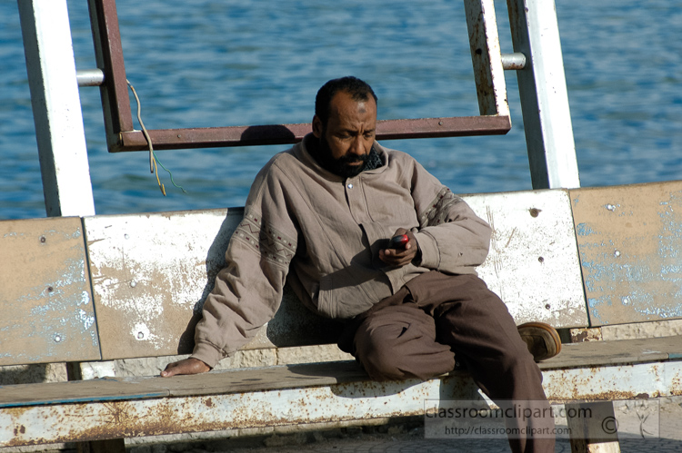 egyptian-man-sitting-at-harbor-near-citadel-alexandria-egypt-5280.jpg