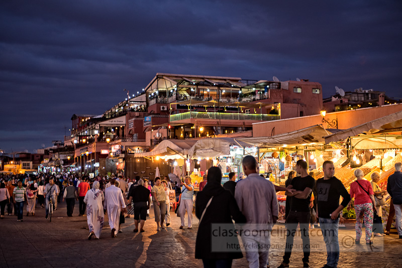 People-walking-around-Djemaa-El-Fna-square-at-dusk-Marrakech-Morocco-photo-Image-6120EE.jpg