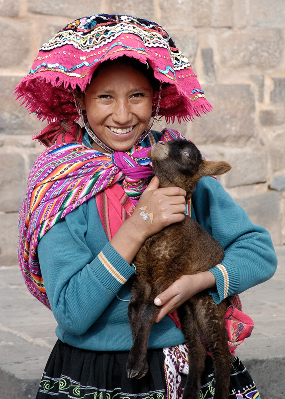 Girl-in-traditional-dress-holding-baby-Alpaca-Cuzco-Peru_012.jpg