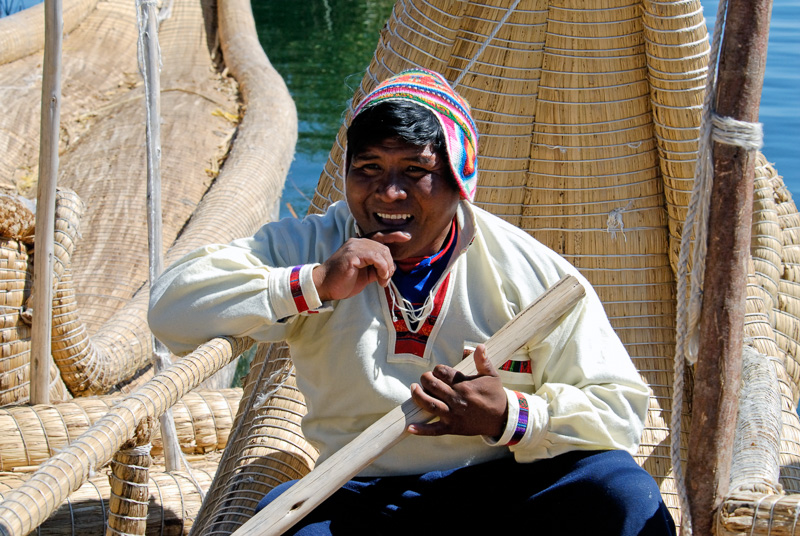 Peruvian-man-in-reed-boat-on-lake-2555A.jpg
