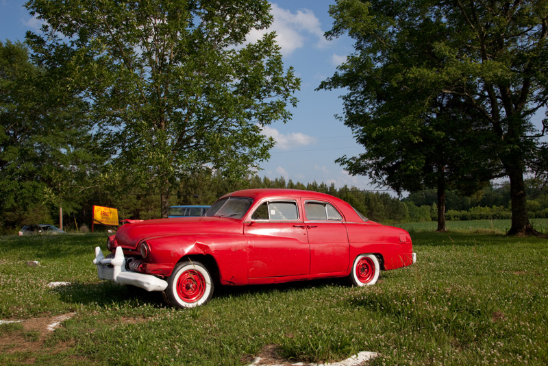 red-painted-old-car-in-field-near-oakville-alabama.jpg