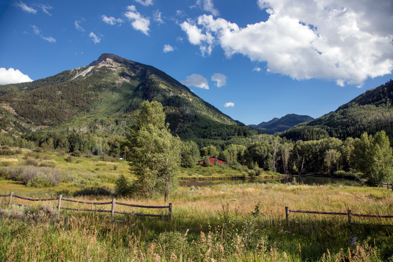 view-of-a-rocky-mountain-peak-and-meadow.jpg