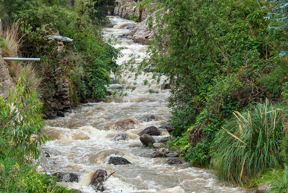 flowing-river-along-mountains-in-peru.jpg