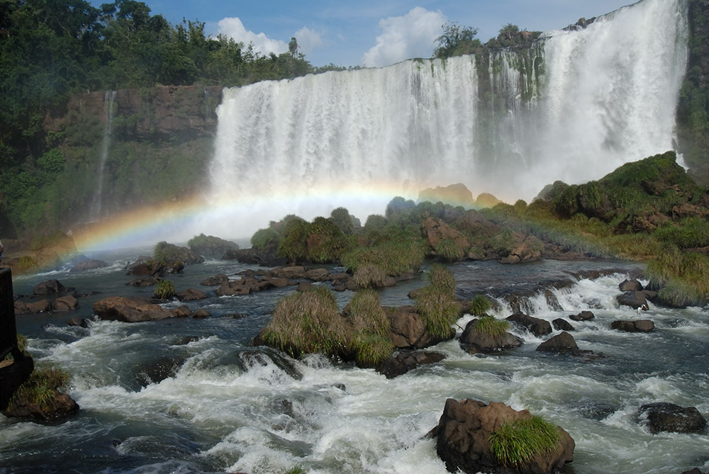 rainbow-over-rocks-iguazu-falls-border-of-argentina-and-brazil.jpg