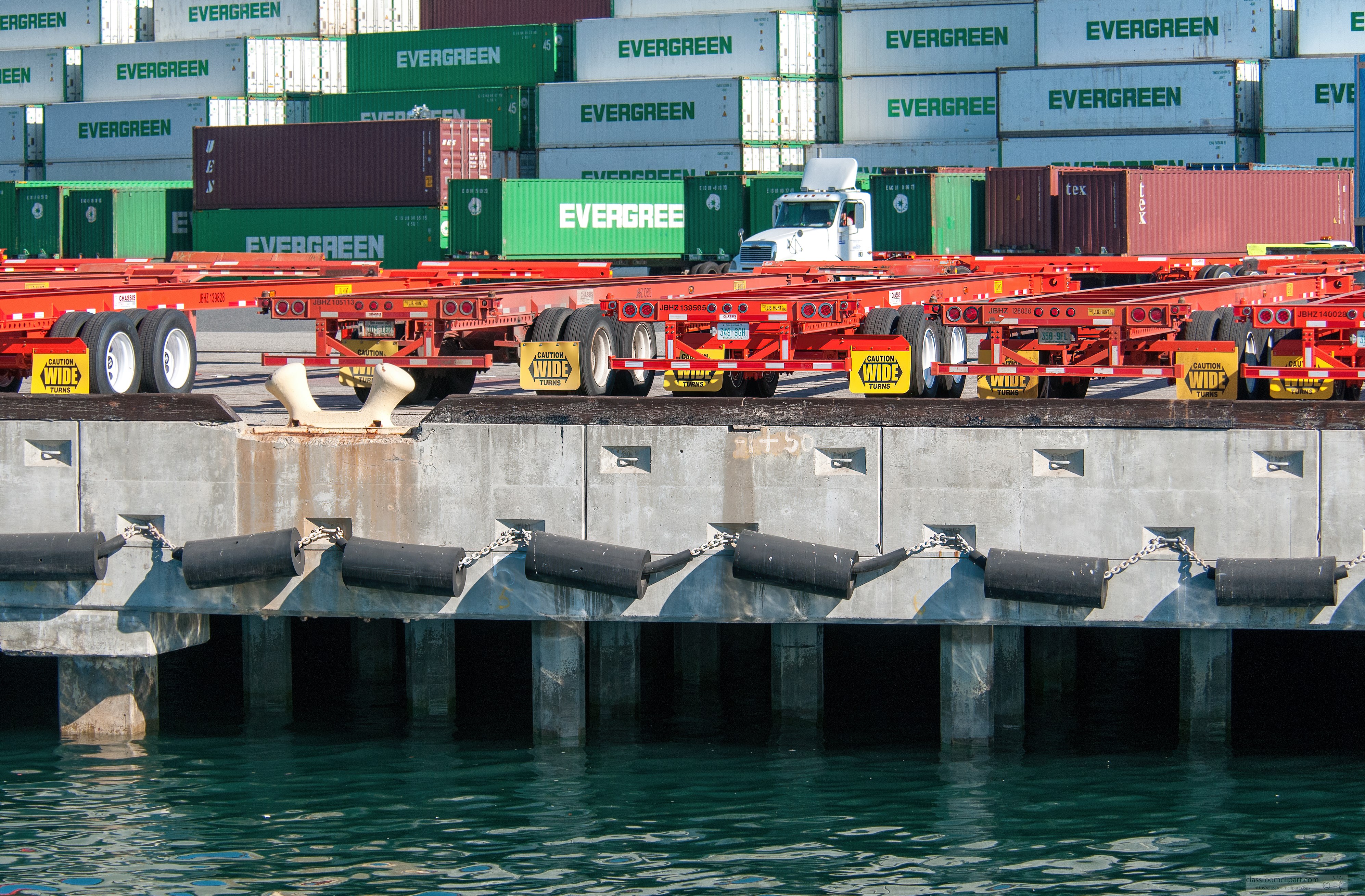 cargo-ship-containers-stacked-along-harbor.jpg