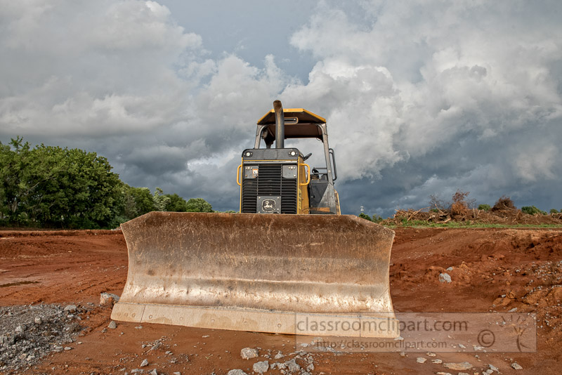 construction-equipment-at-building-site-dark-clouds-photo-image-350E.jpg
