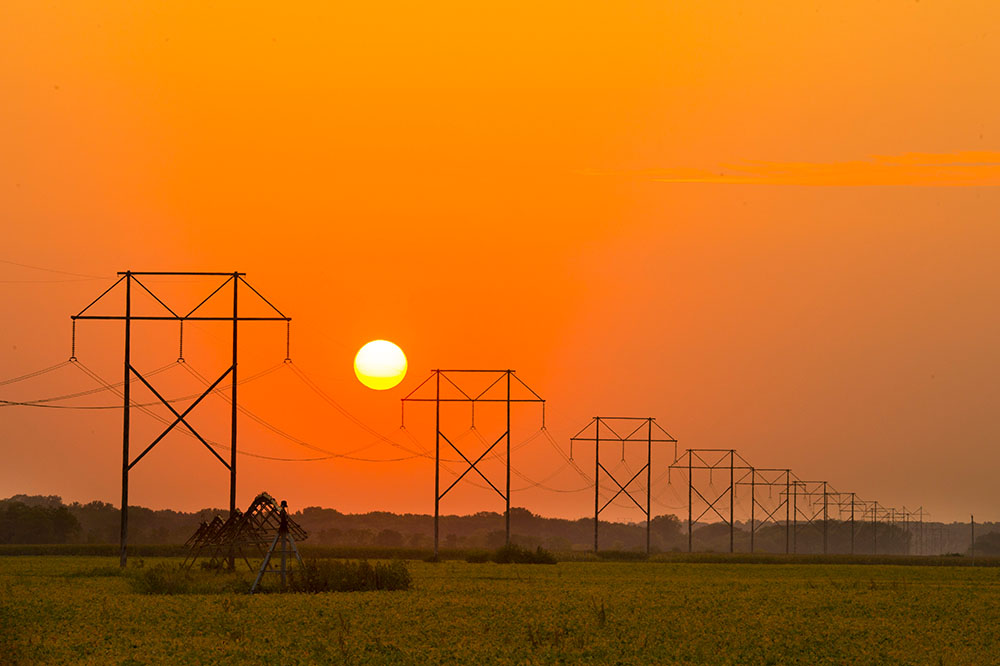 power-lines-during-sunset-outside-of-north-english-iowa.jpg