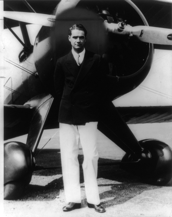 Howard-Hughes-Standing-In-Front-Of-His-New-Boeing-portrait-photo-image.jpg