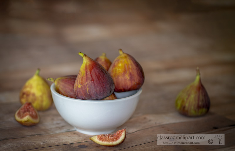 group-of-figs-in-a-white-bowl-wood-background-photo-.jpg