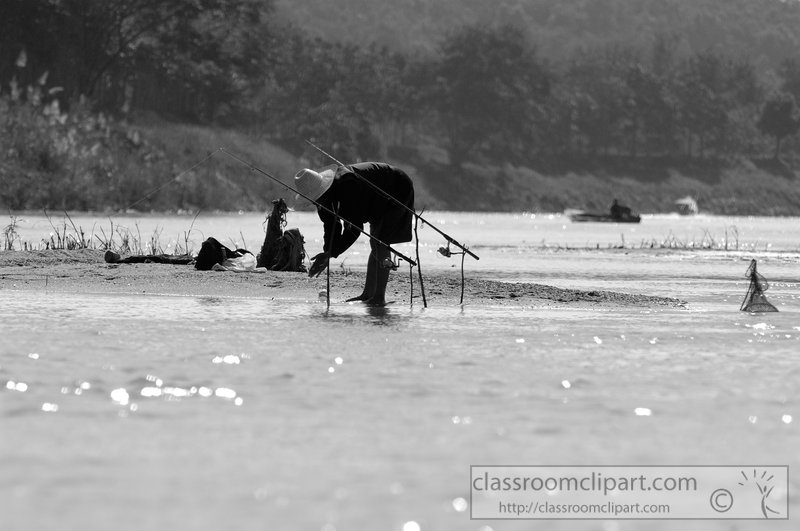 man-fishing-in-shallow-water-river-thailand-black-white-photo-7011.jpg