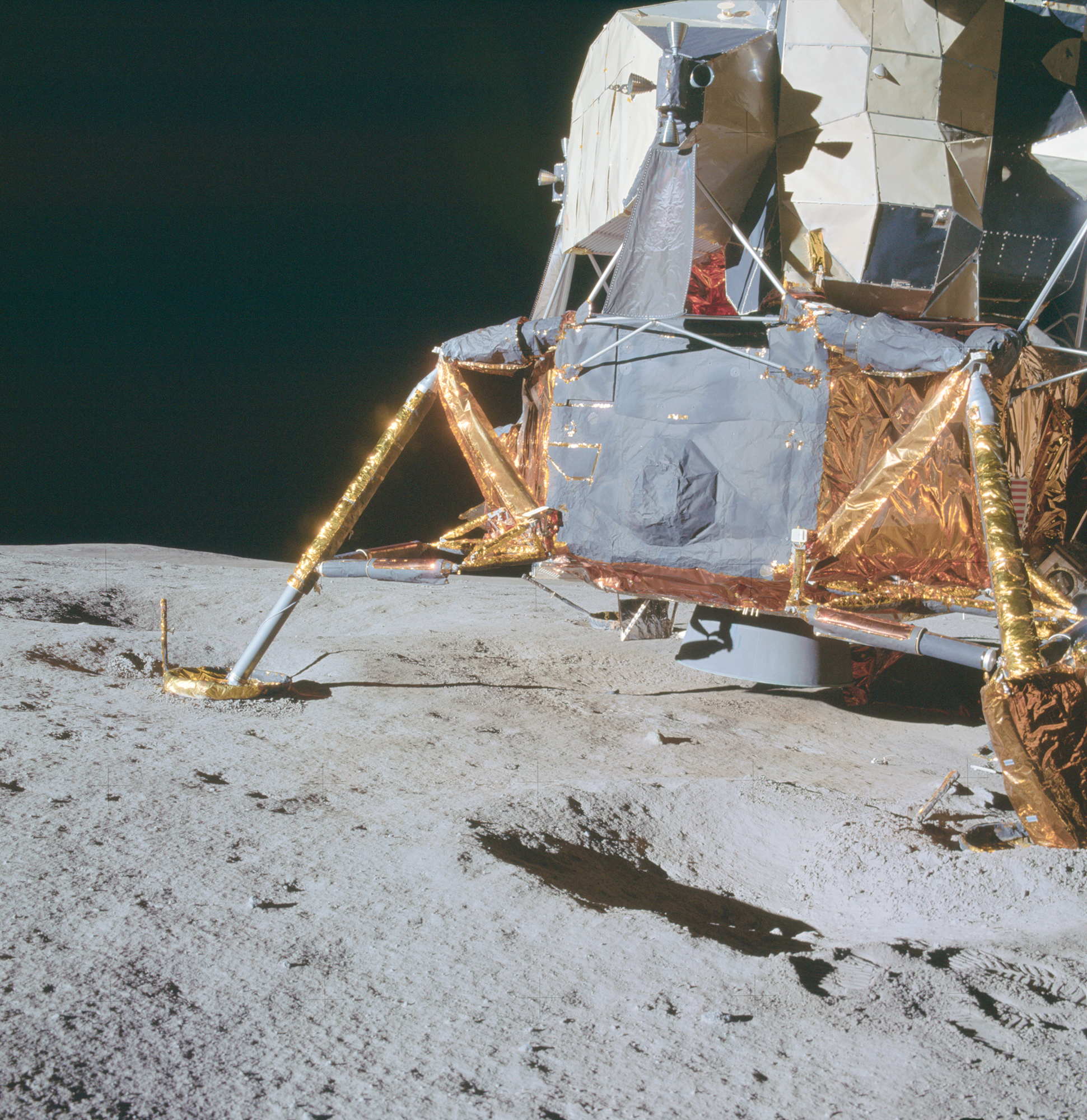 apollo-14-right-side-and-aft-section-of-the-lunar-module-near-a-crater.jpg