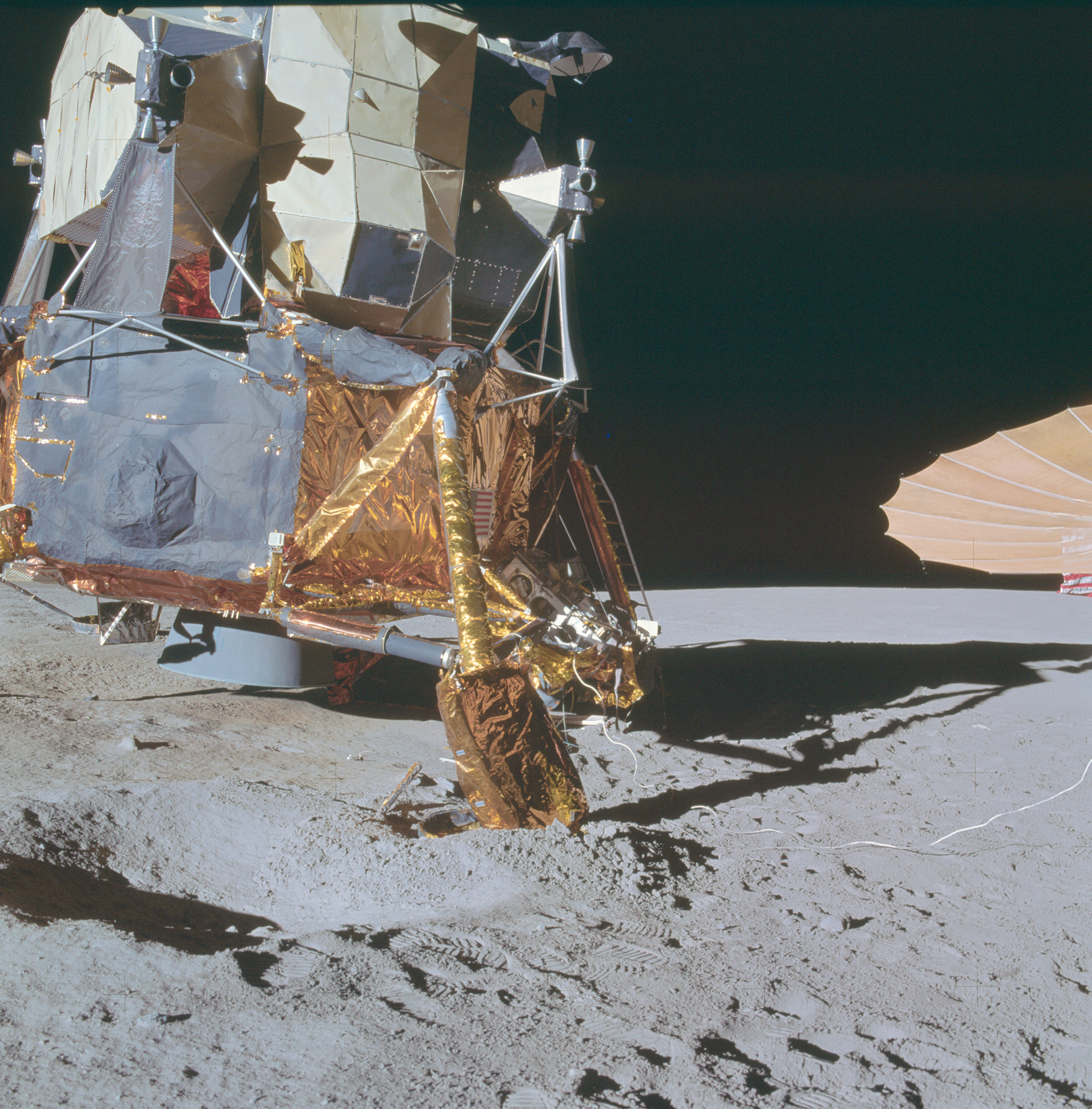 apollo-14-right-side-of-the-lunar-module-with-footpad-buried-in-crater-rim.jpg