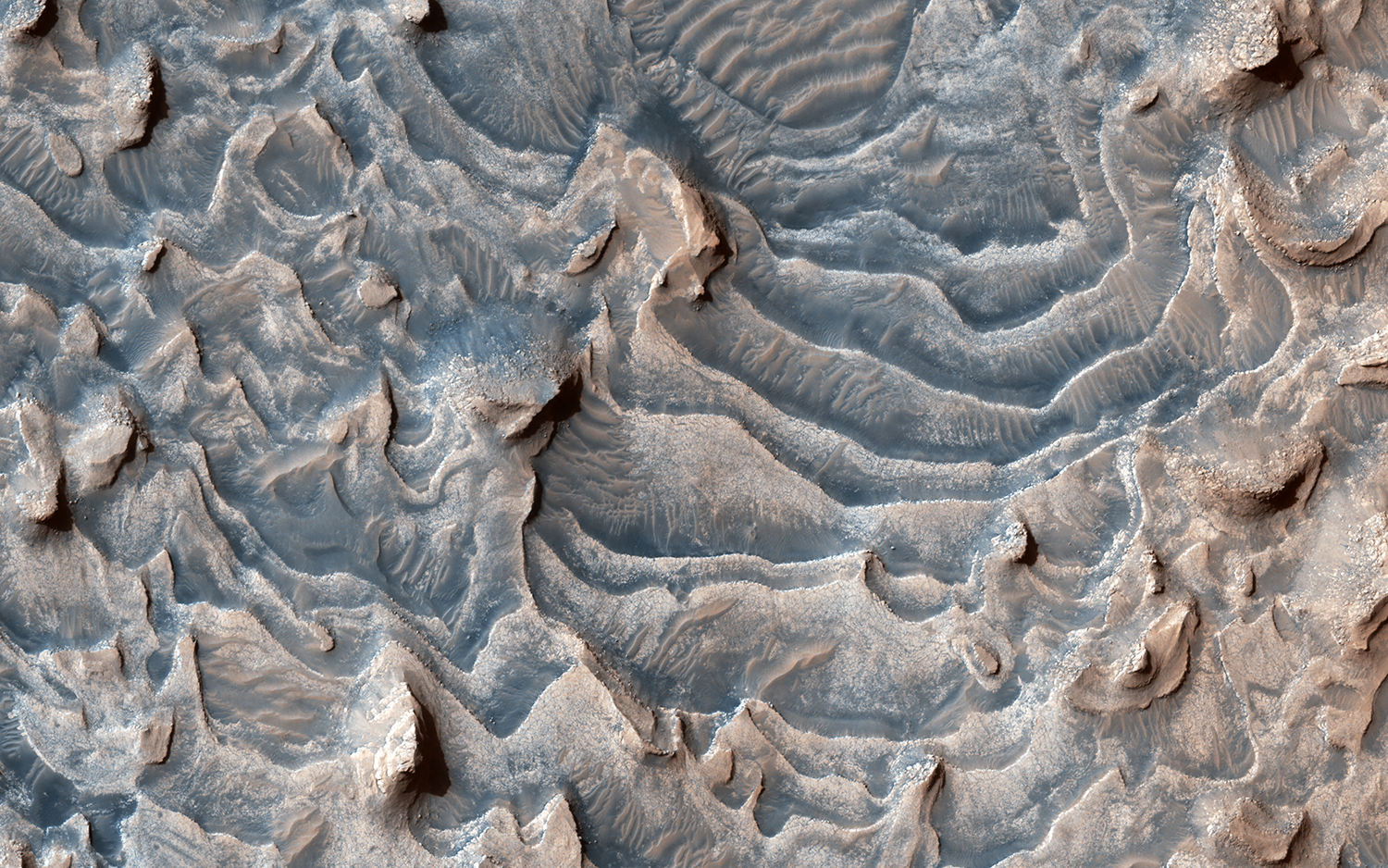 layered-rock-formation-within-jiji-crater-that-has-eroded-into-buttes-and-stair-like-layers.jpg