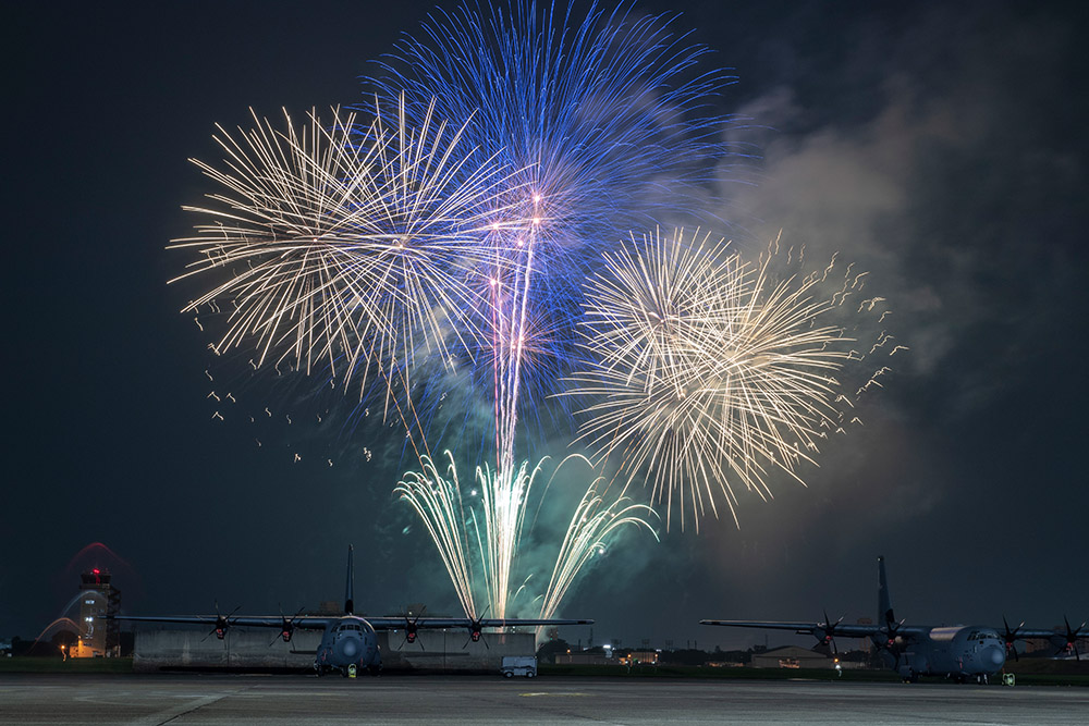 fireworks-explode-behind-a-c-130j-super-hercules.jpg