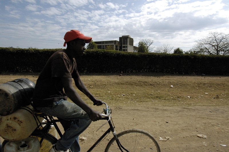 man-riding-bicycle-in-kenya-africa.jpg
