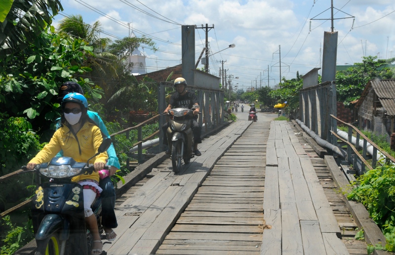 motorcycle-riders-on-wooden-bridge-in-vietnam.jpg